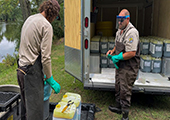 Sea Lamprey Control Technicians Preparing Lampricide Vat